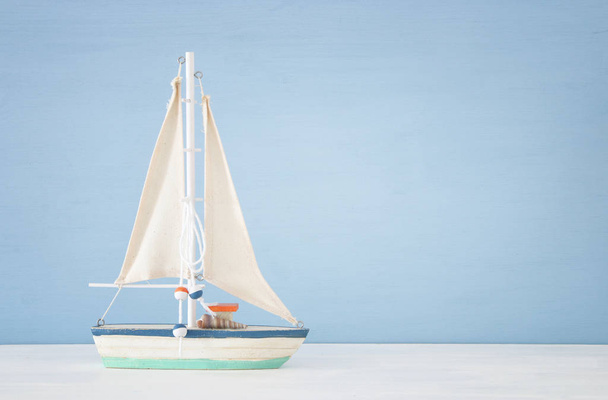 nautical concept with sail boat over blue background. - Фото, изображение
