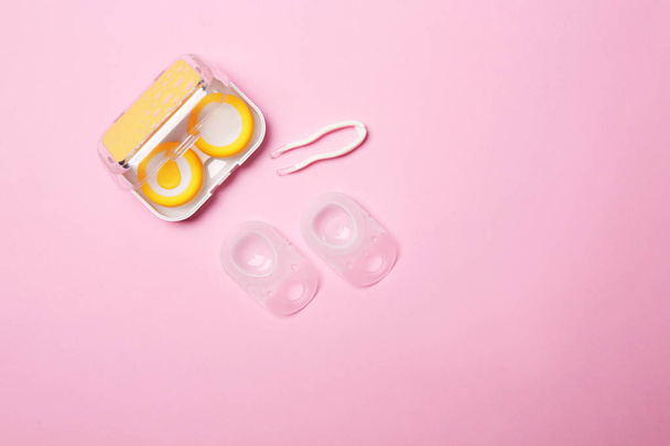Flat lay composition with contact lenses and accessories on color background - Foto, Imagem