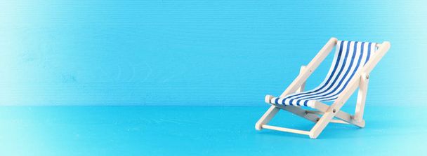 image of beach chair over blue background. - Foto, Imagem