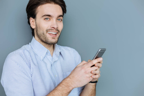 Attractive bearded man chatting online - Фото, изображение