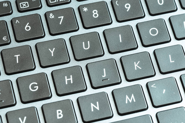 Close-up van laptop toetsenbord knoppen met symbolen  - Foto, afbeelding