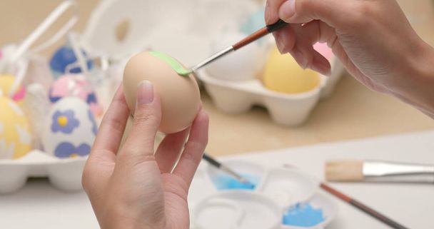 Drawing on egg for Easter holiday  - Foto, afbeelding