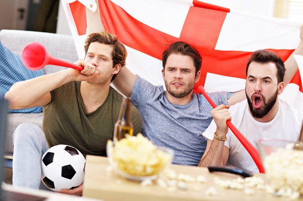 Happy male friends cheering and watching sports on tv - Zdjęcie, obraz