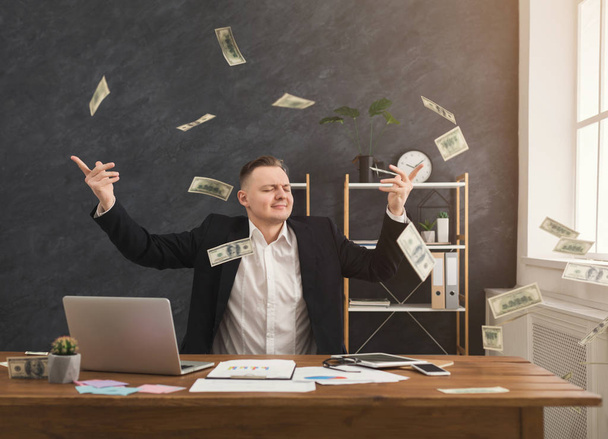 Financier man throwing out dollars in office - Foto, Imagem