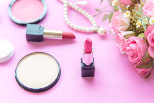 Valentine Gift. Makeup cosmetics tools background and beauty cosmetics, products and facial cosmetics package lipstick with pink rose, Pearl necklace, vintage tone.  Lifestyle and Valentine Concept - Foto, Imagen