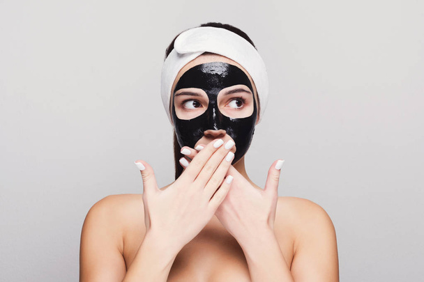Young girl with purifying black face mask - Photo, Image