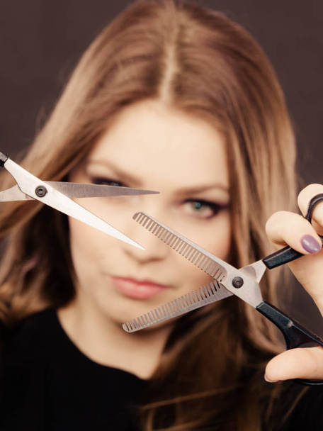 Professional elegant female barber with scissors. - Фото, изображение