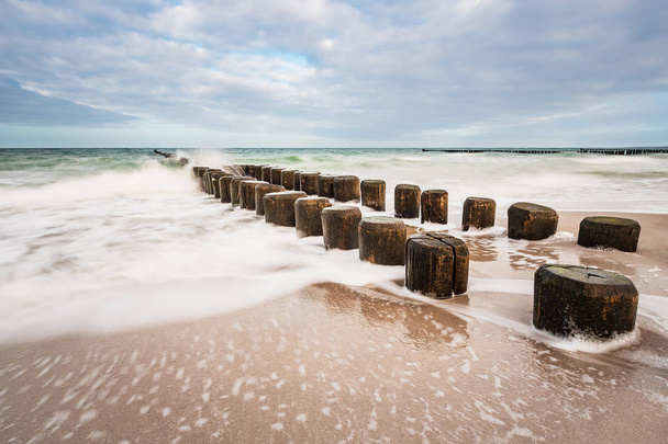 Groynes on shore of the Baltic Sea - Photo, Image