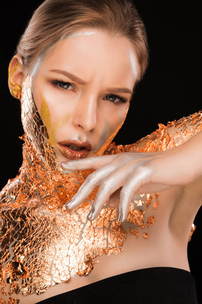 Fashion portrait of wonderful blonde girl with copper foil on he - 写真・画像