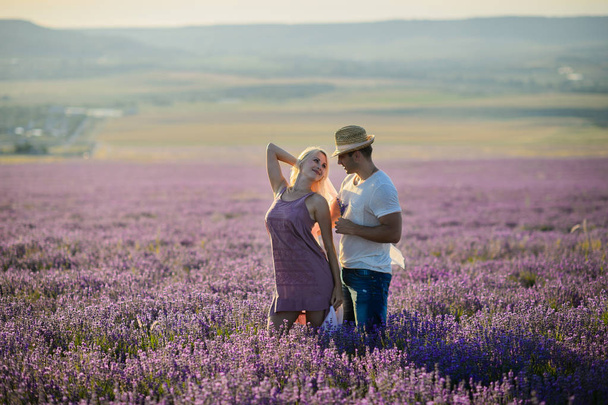 Happy couple in a field of lavender - Valokuva, kuva