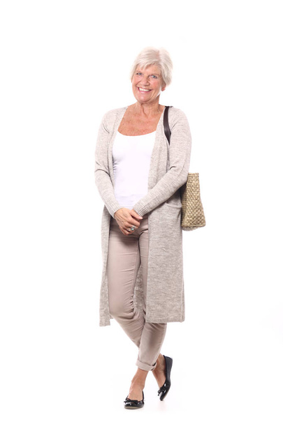 Beautiful elegant mature woman in front of a background - Fotoğraf, Görsel