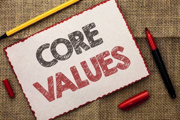 Writing note showing  Core Values. Business photo showcasing Principles Ethics Conceptual Accountability Code Components written on Cardboard Piece on the jute background Markers next to it. - Photo, Image