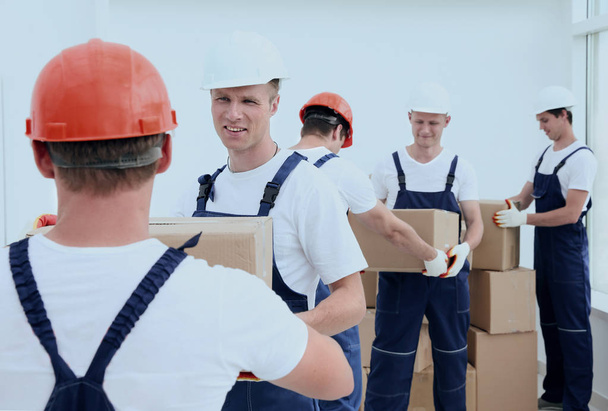 Group of people builders with boxes - Photo, Image