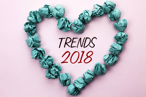 Conceptual hand writing showing Trends 2018. Business photo text Current Movement Latest Modern Branding New Concept Prediction written on Plain background within Heart Paper Balls. - Photo, Image