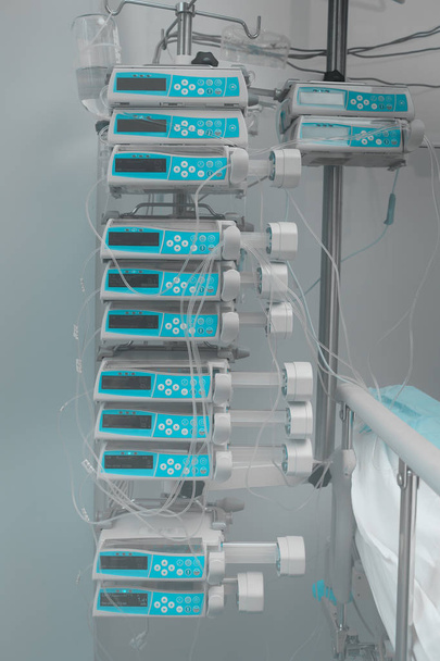 Automatic drug perfusion devices in stack at the hospital room's - Φωτογραφία, εικόνα