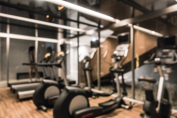 Abstract blur defocused fitness equipment and gym interior - Photo, Image