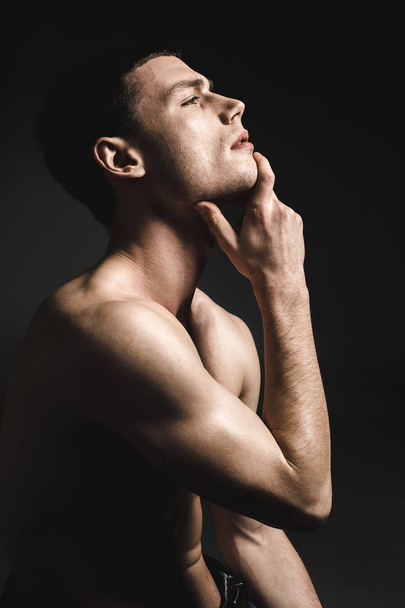 Undressed handsome male demonstrating abstraction - Fotó, kép