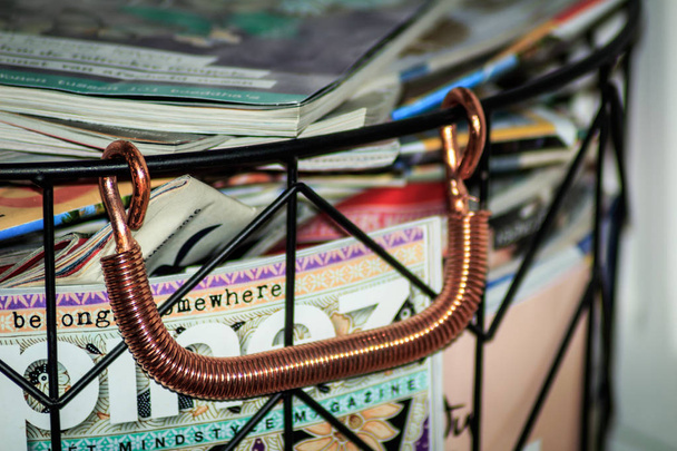 Magazine holder with copper handle - Photo, Image