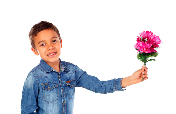 cute happy little African boy in denim shirt with beautiful bouquet of pink flowers isolated on white background - Photo, Image