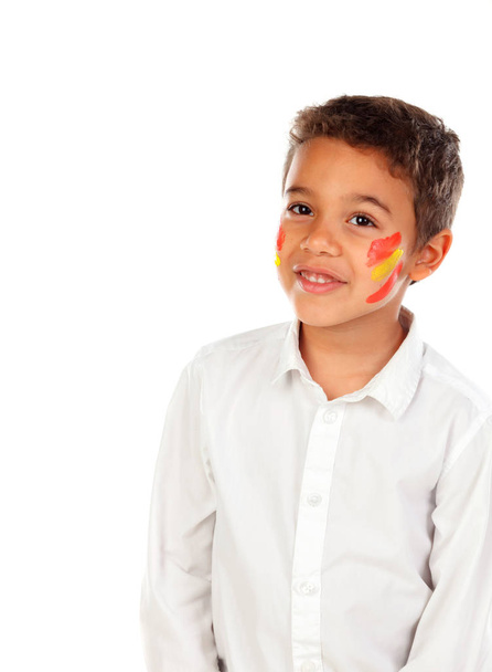 portrait of little African boy with Spanish colors flag painted on face, isolated over white background  - Foto, immagini