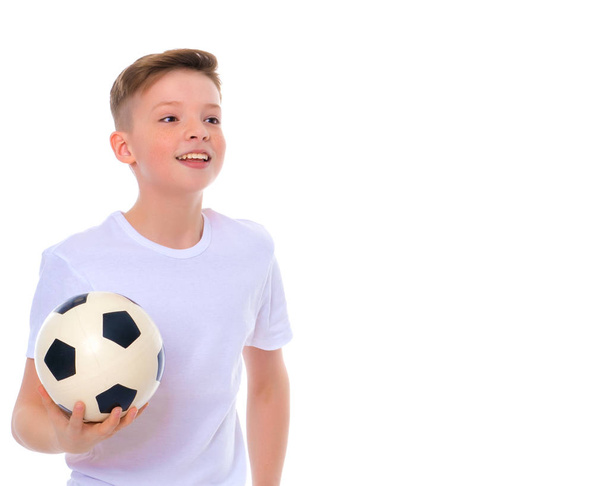 Boy teenager with a soccer ball. - Photo, Image