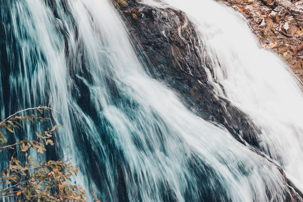 Mountain waterfall in the rocks. Mountain stream, the freshness of the rocks. - Valokuva, kuva