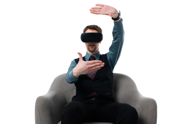 portrait of agent in virtual reality headset sitting in armchair isolated on white - Φωτογραφία, εικόνα