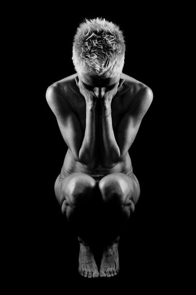 Naked woman on black background - Foto, immagini