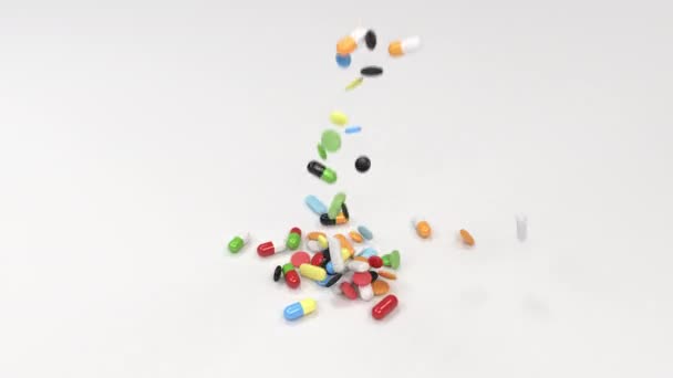 Pile of colorful medicine pills on white background. Pills falling on table. Medical, healthcare or pharmacy concept. 3D rendering illustration - Materiaali, video