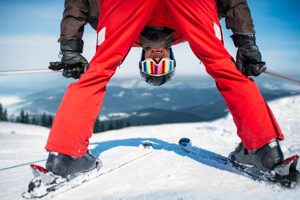 skier in helmet and glasses having fun, winter active sport, extreme lifestyle - Foto, Imagen
