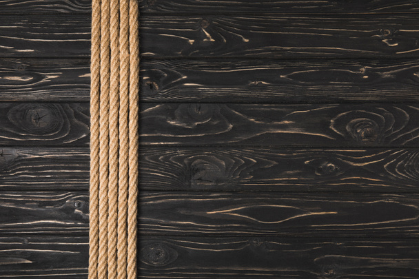 top view of brown nautical ropes placed in row on wooden tabletop - Foto, immagini