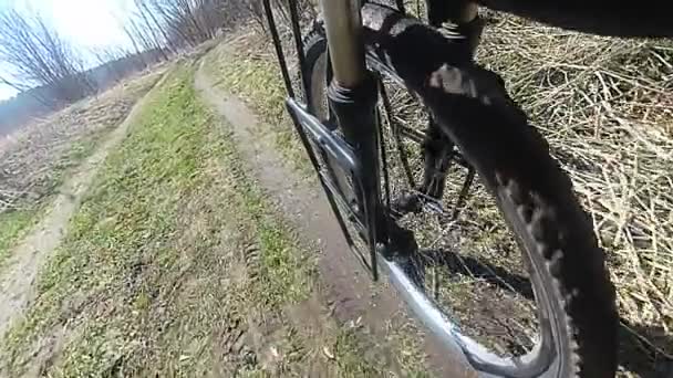 Wheel of  bicycle  with tyre goes on  dirt road. Slow motion.  - Footage, Video