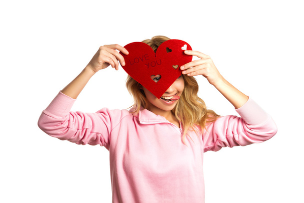Attractive blonde girl holding red heart-shape - Foto, Imagem