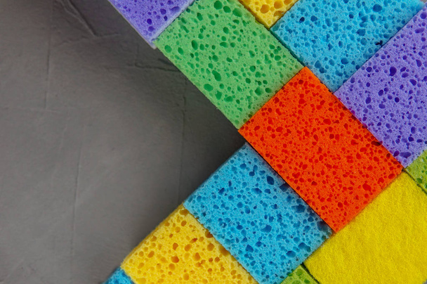 Cleaning day concept, colorful sponges over gray concrete background - Valokuva, kuva