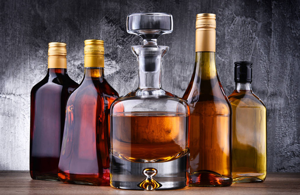 Carafe and bottles of assorted alcoholic beverages. - Photo, Image