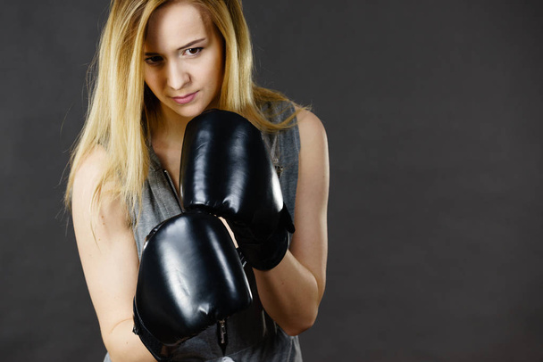 Boxer girl exercise with boxing gloves. - Photo, image