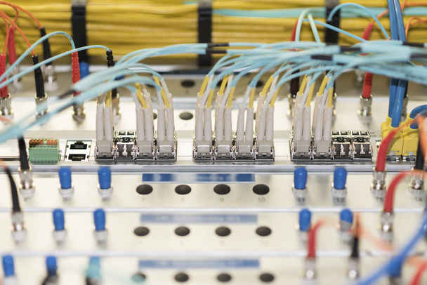High-speed networking equipment, switch with fiber optic modules, close-up - 写真・画像