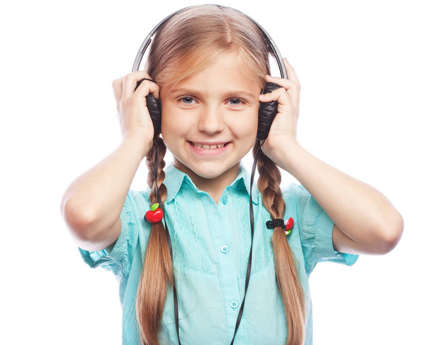 technology, people and music concept - little blond girl with headphones isolated on white background - Фото, зображення
