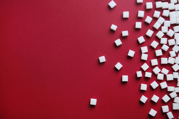 Refined sugar cubes on color background, top view - Foto, Bild