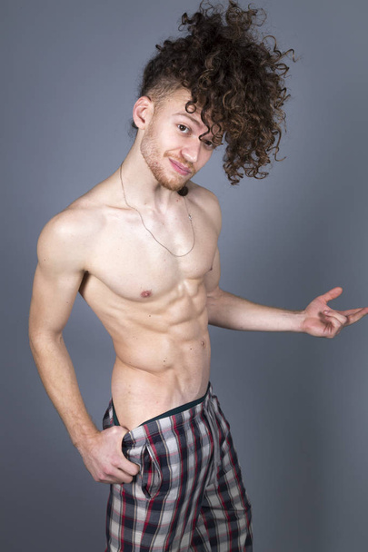 Young athletic ginger in pyjamas man studio portrait - Foto, imagen
