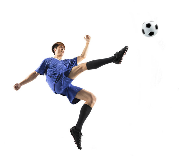 футболіст в дії ізольований білий фон
 - Фото, зображення