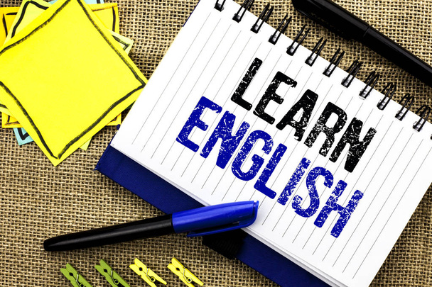Conceptual hand writing showing Learn English. Business photo showcasing Study another Language Learn Something Foreign Communication written on Notebook Book on the jute background Clips and Pens - Photo, Image