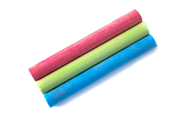 Colored chalks on white background with soft shadows - Photo, Image