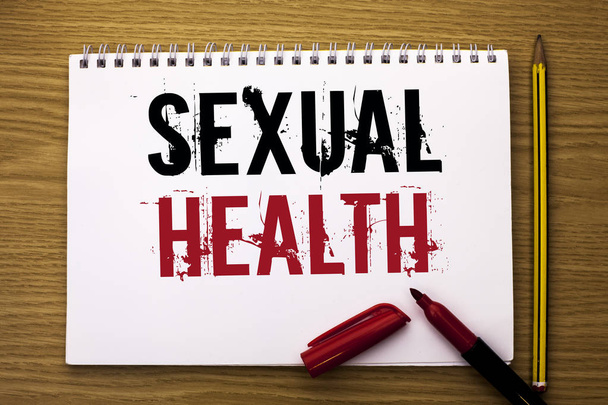 Writing note showing  Sexual Health. Business photo showcasing STD prevention Use Protection Healthy Habits Sex Care written on Notebook Book on the wooden background Marker and Pencil. - Фото, изображение