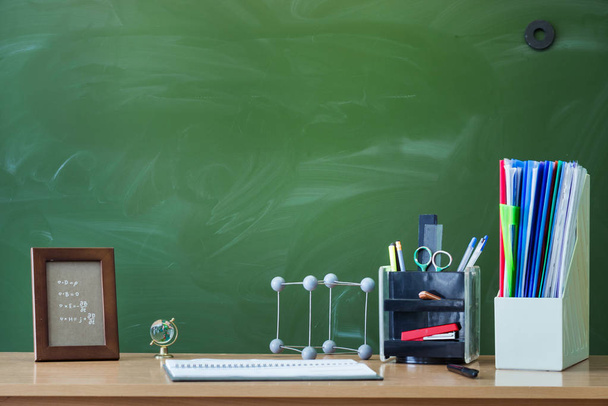 Teacher or student desk table. Education background. Education concept. School accessories on the table. - Foto, Imagen