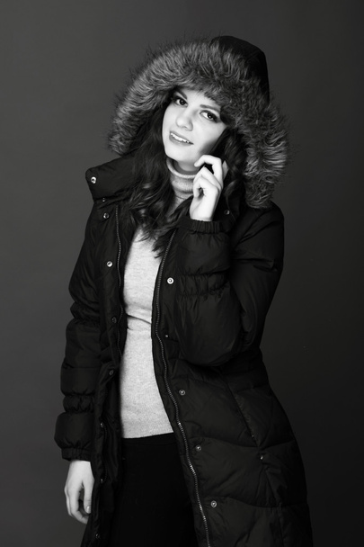 Warmly dressed girl talking on the phone - Foto, Imagen