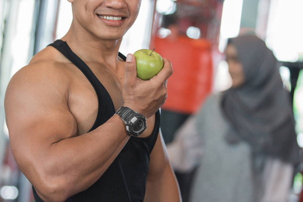 Healthy asian muscular man close up  - Фото, изображение