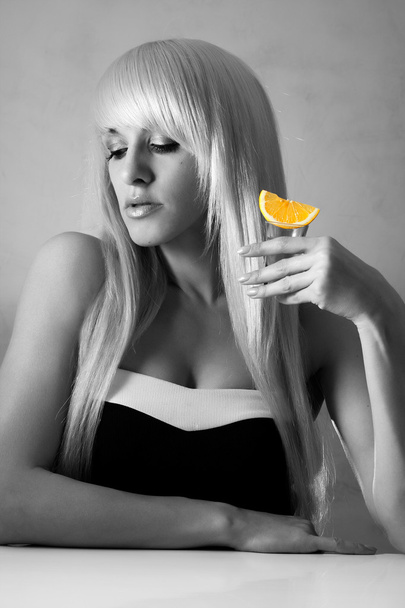 Beautiful blonde in a bar drinking tequila - Photo, Image