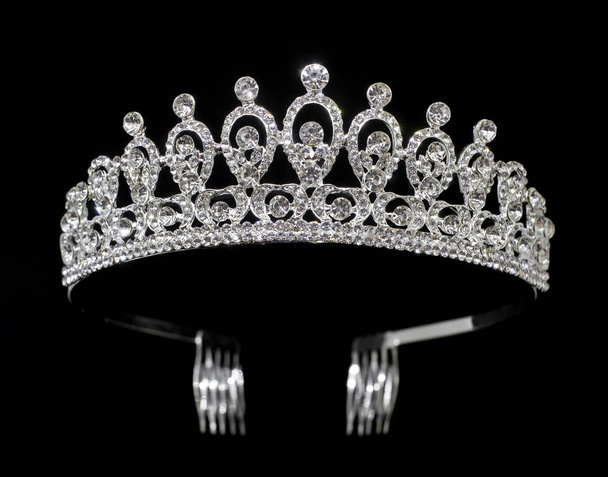 Silver tiara diadem with gems and diamonds isolated on black background - Photo, Image