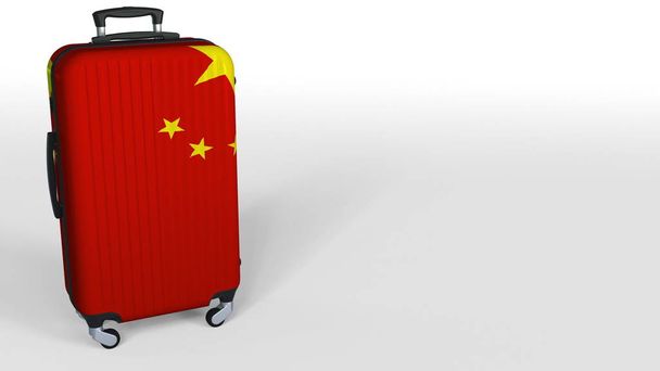 Travelers suitcase featuring flag of China. Chinese tourism conceptual 3D rendering, blank space for caption - Фото, зображення